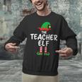 The Teacher Elf Matching Family Christmas Unisex Sweatshirt, gift for family, gift for coworker The Teacher Elf Matching Family Christmas Unisex Sweatshirt, gift for family, gift for coworker