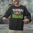Teachers Love Brains Halloween Teacher Zombie Unisex Sweatshirt, gift for family, gift for coworker Teachers Love Brains Halloween Teacher Zombie Unisex Sweatshirt, gift for family, gift for coworker