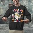 Trick Or Teach Groovy Teacher Halloween Retro Teacher Ghost Unisex Sweatshirt, Groovy Teacher Sweatshirts, gift for family, gift for coworker