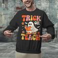 Trick Or Teach Halloween Shirt For Teacher Kids Floral Ghost Unisex Sweatshirt, gift for family, gift for coworker Trick Or Teach Halloween Shirt For Teacher Kids Floral Ghost Unisex Sweatshirt, gift for family, gift for coworker