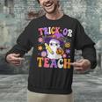 Trick Or Teach Teacher Ghost Teaching Fun Halloween Teacher Unisex Sweatshirt, gift for family, gift for coworker Trick Or Teach Teacher Ghost Teaching Fun Halloween Teacher Unisex Sweatshirt, gift for family, gift for coworker