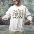 First Grade Teacher Wildflower Back To School Floral Outfits Unisex Sweatshirt, First Grade Teacher Sweatshirts, gift for family, gift for coworker First Grade Teacher Wildflower Back To School Floral Outfits Unisex Sweatshirt, First Grade Teacher Sweatshirts, gift for family, gift for coworker