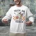 Trick Or Teach Teacher Unisex Sweatshirt, gift for family, gift for coworker Trick Or Teach Teacher Unisex Sweatshirt, gift for family, gift for coworker