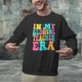 In My Glowing Teacher Era Groovy Colorful Bright Men Graphic Sweatshirt, Groovy Teacher Sweatshirts, gift for family, gift for coworker In My Glowing Teacher Era Groovy Colorful Bright Men Graphic Sweatshirt, Groovy Teacher Sweatshirts, gift for family, gift for coworker