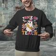 Retro Floral Ghost Trick Or Teach Groovy Teacher Halloween Men Graphic Sweatshirt, Groovy Teacher Sweatshirts, gift for family, gift for coworker Retro Floral Ghost Trick Or Teach Groovy Teacher Halloween Men Graphic Sweatshirt, Groovy Teacher Sweatshirts, gift for family, gift for coworker