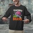Teachers Love Brains Halloween 2025 Skeleton Costume Men Graphic Sweatshirt, gift for family, gift for coworker Teachers Love Brains Halloween 2025 Skeleton Costume Men Graphic Sweatshirt, gift for family, gift for coworker