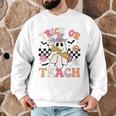 Trick Or Teach Groovy Teacher Halloween Retro Floral Ghost Men Graphic Sweatshirt, novelty gifts, funny gifts