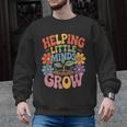 Helping Little Minds Grow Teacher First Day Back To School Men Graphic Sweatshirt, trending gift