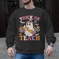 Retro Floral Ghost Trick Or Teach Groovy Teacher Halloween Men Graphic Sweatshirt, Groovy Teacher Gifts, trending gift Retro Floral Ghost Trick Or Teach Groovy Teacher Halloween Men Graphic Sweatshirt, Groovy Teacher Gifts, trending gift