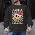 Santas Favorite Teacher Retro Groovy Smile Face Christmas Men Graphic Sweatshirt, Groovy Teacher Gifts, trending gift