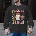 Trick Or Teach Ghost Teacher School Halloween Men Women Men Graphic Sweatshirt, trending gift Trick Or Teach Ghost Teacher School Halloween Men Women Men Graphic Sweatshirt, trending gift
