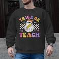 Trick Or Teach Groovy Halloween Teachers Men Graphic Sweatshirt, trending gift Trick Or Teach Groovy Halloween Teachers Men Graphic Sweatshirt, trending gift
