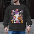 Trick Or Teach Groovy Teacher Ghost Halloween Teacher Men Graphic Sweatshirt, Groovy Teacher Gifts, trending gift Trick Or Teach Groovy Teacher Ghost Halloween Teacher Men Graphic Sweatshirt, Groovy Teacher Gifts, trending gift