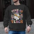 Trick Or Teach Groovy Teacher Halloween Retro Ghost Men Graphic Sweatshirt, Groovy Teacher Gifts, trending gift Trick Or Teach Groovy Teacher Halloween Retro Ghost Men Graphic Sweatshirt, Groovy Teacher Gifts, trending gift