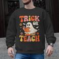 Trick Or Teach Halloween Shirt For Teacher Kids Floral Ghost Men Graphic Sweatshirt, trending gift Trick Or Teach Halloween Shirt For Teacher Kids Floral Ghost Men Graphic Sweatshirt, trending gift