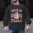 Trick Or Teach Halloween Teacher Floral Ghost Groovy Men Graphic Sweatshirt, Groovy Teacher Gifts, trending gift Trick Or Teach Halloween Teacher Floral Ghost Groovy Men Graphic Sweatshirt, Groovy Teacher Gifts, trending gift