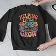 Helping Little Minds Grow Teacher First Day Back To School Men Graphic Sweatshirt, funny design