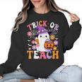 Trick Or Teach Groovy Teacher Ghost Halloween Teacher Women Crewneck Sweatshirt, Groovy Teacher Gifts, trending gift Trick Or Teach Groovy Teacher Ghost Halloween Teacher Women Crewneck Sweatshirt, Groovy Teacher Gifts, trending gift