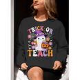 Trick Or Teach Groovy Teacher Ghost Halloween Teacher Women Crewneck Sweatshirt, Groovy Teacher Sweatshirts, funny gift Trick Or Teach Groovy Teacher Ghost Halloween Teacher Women Crewneck Sweatshirt, Groovy Teacher Sweatshirts, funny gift