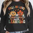 Fall In Love With Learning Shirt Autumn Thanksgiving Teacher Women Crewneck Sweatshirt, funny design