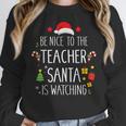 Be Nice Teacher Santa Watching Xmas School Students For Men Women Women Crewneck Sweatshirt, funny design