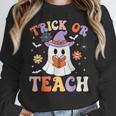 Trick Or Teach Teacher Groovy Ghost Halloween Teacher Women Crewneck Sweatshirt, Groovy Teacher Gifts, funny design Trick Or Teach Teacher Groovy Ghost Halloween Teacher Women Crewneck Sweatshirt, Groovy Teacher Gifts, funny design