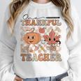 One Thankful Teacher Thanksgiving Groovy Fall Autumn Teacher Women Crewneck Sweatshirt, Groovy Teacher Gifts, funny design