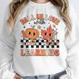Retro Fall In Love With Learning Autumn Pumpkin Teacher Women Crewneck Sweatshirt, funny design Retro Fall In Love With Learning Autumn Pumpkin Teacher Women Crewneck Sweatshirt, funny design