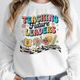 Retro Teaching Future Leaders Groovy Teacher Back To School Women Crewneck Sweatshirt, Future Teacher Gifts, Groovy Teacher Gifts, funny design