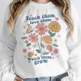 Teach Them Love Them Watch Them Grow Retro Teacher Floral Women Crewneck Sweatshirt, funny design