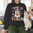 Trick Or Teach Teacher Groovy Ghost Halloween Teacher Women Crewneck Sweatshirt, Groovy Teacher Sweatshirts, gift for family, gift for coworker Trick Or Teach Teacher Groovy Ghost Halloween Teacher Women Crewneck Sweatshirt, Groovy Teacher Sweatshirts, gift for family, gift for coworker