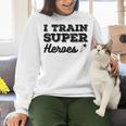 I Train Superheroes For Teacher Coach Men Women Women Crewneck Sweatshirt, gift for family, gift for coworker I Train Superheroes For Teacher Coach Men Women Women Crewneck Sweatshirt, gift for family, gift for coworker
