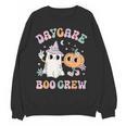 Daycare Boo Crew Groovy Halloween Floral Ghost Kid Teacher Women Crewneck Sweatshirt, novelty gifts, funny gifts