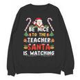 Be Nice To The Teacher Santa Is Watching Christmas Women Crewneck Sweatshirt, novelty gifts, funny gifts Be Nice To The Teacher Santa Is Watching Christmas Women Crewneck Sweatshirt, novelty gifts, funny gifts