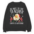 Be Nice To The Teacher Santa Is Watching School Christmas Women Crewneck Sweatshirt, novelty gifts, funny gifts Be Nice To The Teacher Santa Is Watching School Christmas Women Crewneck Sweatshirt, novelty gifts, funny gifts
