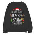 Be Nice Teacher Santa Watching Xmas School Students For Men Women Women Crewneck Sweatshirt, novelty gifts, funny gifts