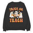 Teacher Halloween Trick Or Teach Retro Groovy Floral Ghost Women Crewneck Sweatshirt, novelty gifts, funny gifts Teacher Halloween Trick Or Teach Retro Groovy Floral Ghost Women Crewneck Sweatshirt, novelty gifts, funny gifts