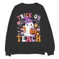 Trick Or Teach Groovy Teacher Ghost Halloween Teacher Women Crewneck Sweatshirt, novelty gifts, funny gifts Trick Or Teach Groovy Teacher Ghost Halloween Teacher Women Crewneck Sweatshirt, novelty gifts, funny gifts
