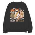 Trick Or Teach Groovy Teacher Halloween Floral Ghost Women Crewneck Sweatshirt, novelty gifts, funny gifts Trick Or Teach Groovy Teacher Halloween Floral Ghost Women Crewneck Sweatshirt, novelty gifts, funny gifts