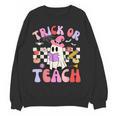 Trick Or Teach Halloween Teacher Floral Ghost Groovy Women Crewneck Sweatshirt, novelty gifts, funny gifts Trick Or Teach Halloween Teacher Floral Ghost Groovy Women Crewneck Sweatshirt, novelty gifts, funny gifts