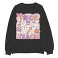 Trick Or Teach Retro Halloween Teacher Look Women Crewneck Sweatshirt, novelty gifts, funny gifts Trick Or Teach Retro Halloween Teacher Look Women Crewneck Sweatshirt, novelty gifts, funny gifts