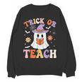 Trick Or Teach Teacher Groovy Ghost Halloween Teacher Women Crewneck Sweatshirt, novelty gifts, funny gifts Trick Or Teach Teacher Groovy Ghost Halloween Teacher Women Crewneck Sweatshirt, novelty gifts, funny gifts