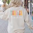 Toddler Teacher Retro Groovy Women Happy First Day Of School Women's Sweatshirt Back Print Sand