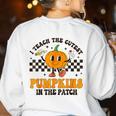 I Teach The Cutest Pumpkins In The Patch Groovy Teacher Fall Women's Sweatshirt Back Print White