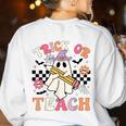 Trick Or Teach Groovy Teacher Halloween Retro Floral Ghost Women's Sweatshirt Back Print White