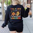 Groovy Fall In Love With Learning Autumn Pumpkin Teacher Women's Sweatshirt Back Print Black