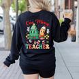 One Merry Teacher Groovy Christmas Tree Pjs Xmas Teacher Women's Sweatshirt Back Print Black One Merry Teacher Groovy Christmas Tree Pjs Xmas Teacher Women's Sweatshirt Back Print Black