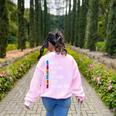 Educar Bilingual Spanish Teacher Women's Sweatshirt Back Print Light Pink