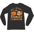 Fall In Love With Reading Book Autumn Pumpkins And Teachers Unisex Long Sleeve T-Shirt, trending gift