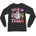 Trick Or Teach Halloween Teacher Floral Ghost Groovy Unisex Long Sleeve T-Shirt, trending gift Trick Or Teach Halloween Teacher Floral Ghost Groovy Unisex Long Sleeve T-Shirt, trending gift